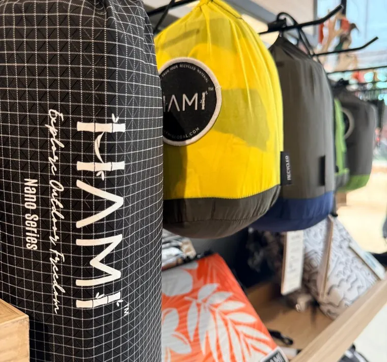 HAMI Nano Series stuff sacks on a shop shelf, each holding a packed Nano Hammock